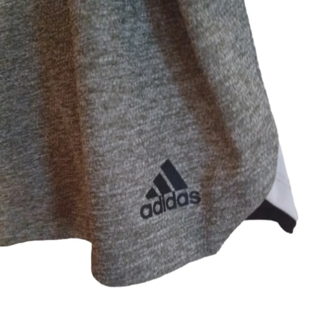 NWT   Adidas knit Grey shorts. Black waist band, white stripes. Size medium.